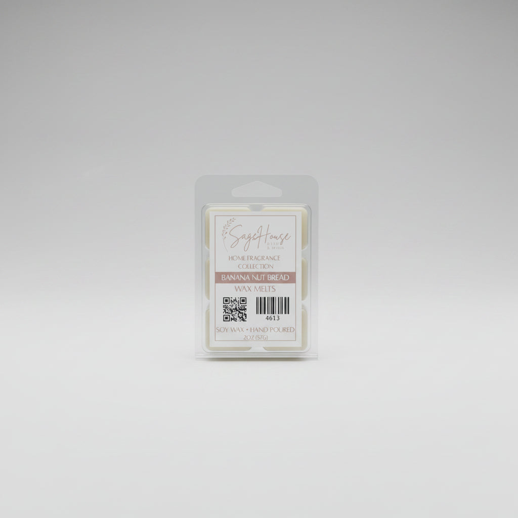 A clear clamshell container holding 6 wax melt cubes with a label on top, placed on a wooden surface against a wooden background.