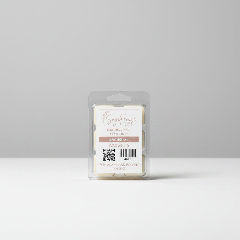 A clear clamshell container holding 6 wax melt cubes with a label on top, placed on a wooden surface against a wooden background.