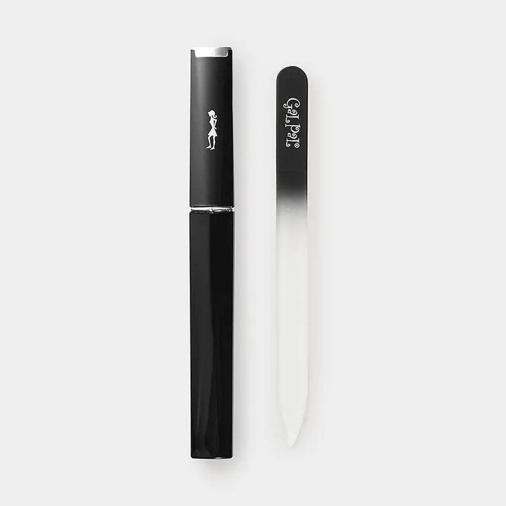 A black and white glass nail file presented in a sleek, compact case.