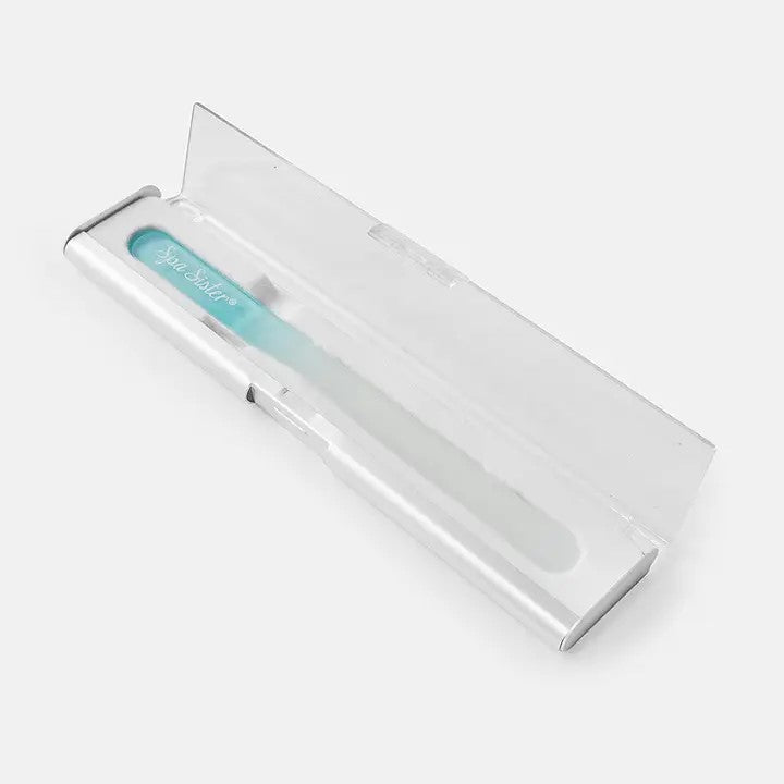 A teal and white glass nail file presented in a sleek, compact case.