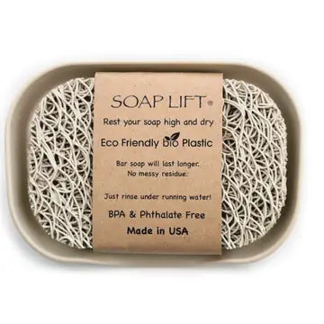 Bone colored soap dish with soap lift sitting inside. Soap lift sold seperately. On a white background