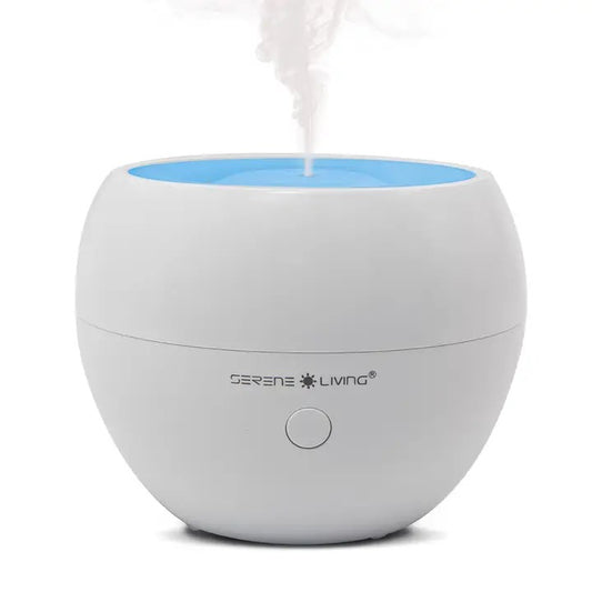A white and blue oil diffuser with a visible mist coming out from the top.