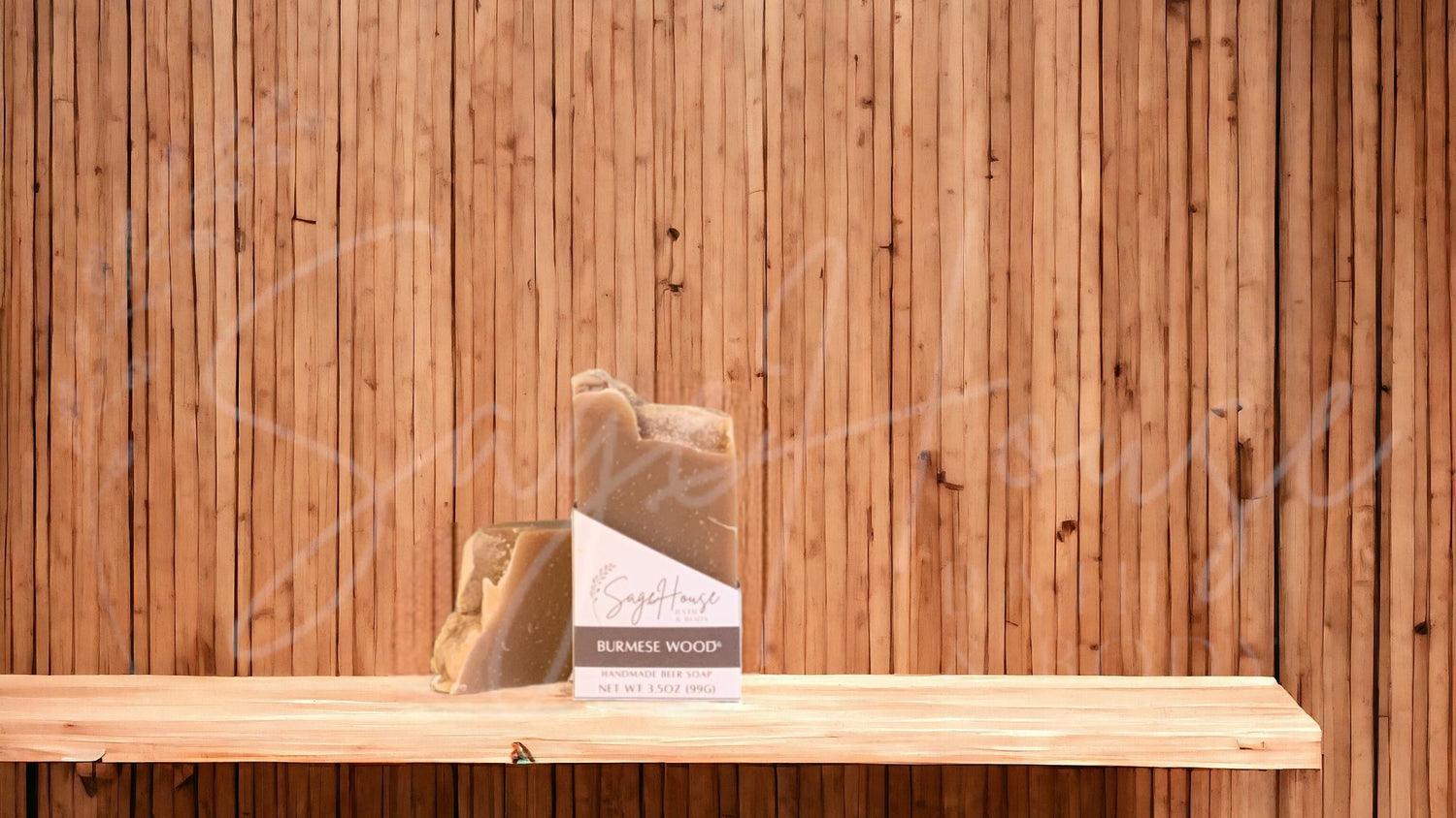 A tan colored bar of soap with a white label. on a wood surface.