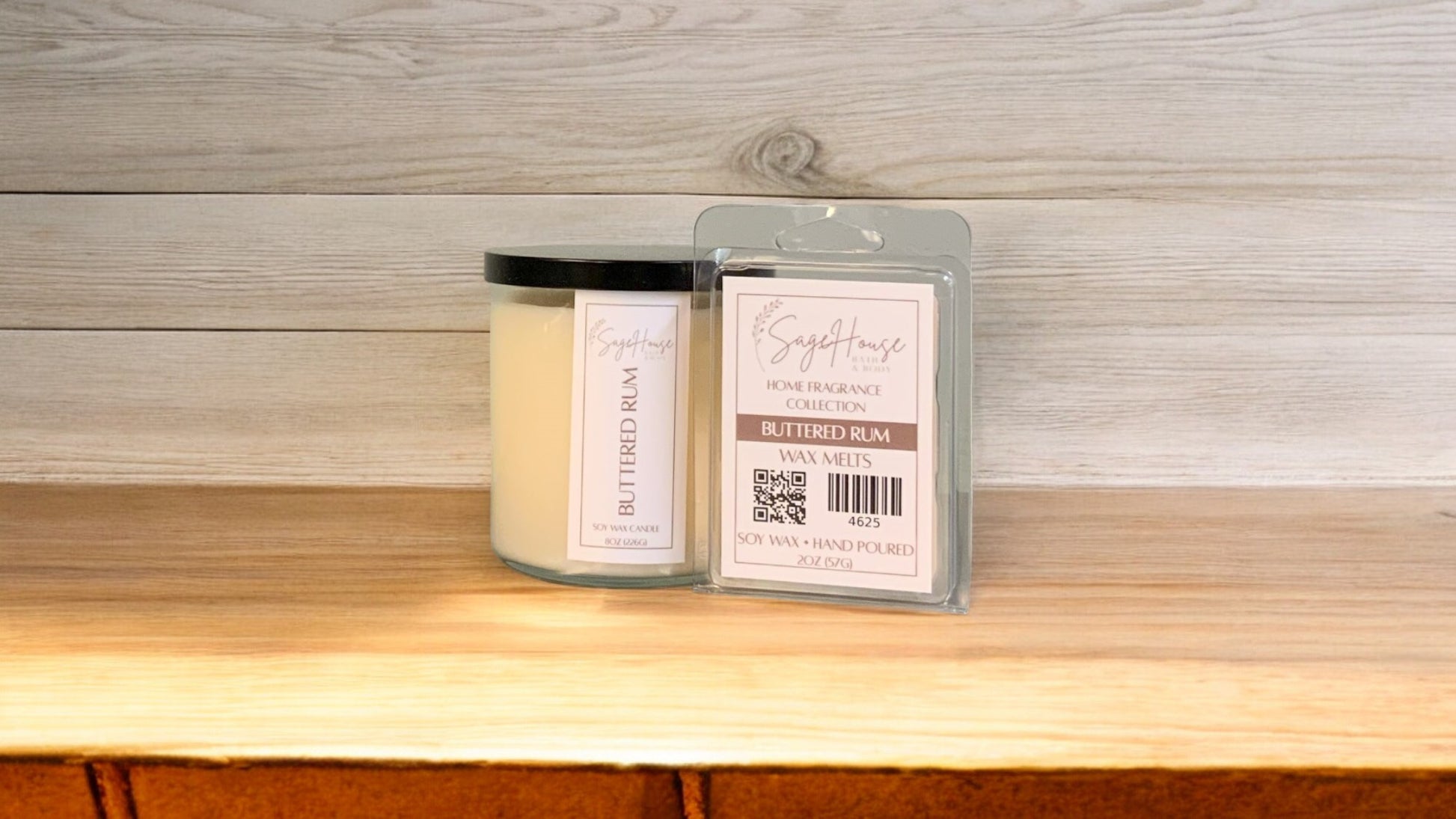 A white soy wax candle in a clear container, next to a clear clamshell wax melt package. placed on a wooden surface, with a label on the front.