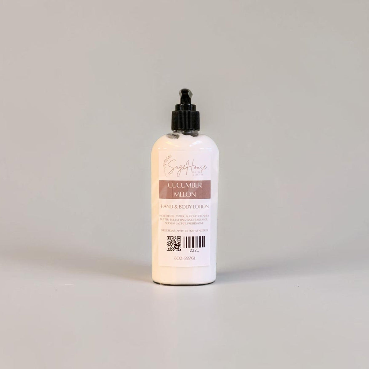 A large bottle of lotion with black pump top and white label. On a white background.