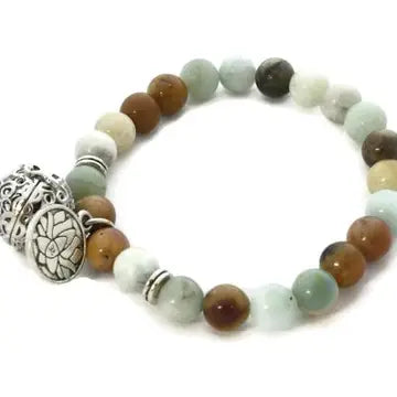 bracelet with multi color neutral beads, with lava bead inside of silver ball attached.