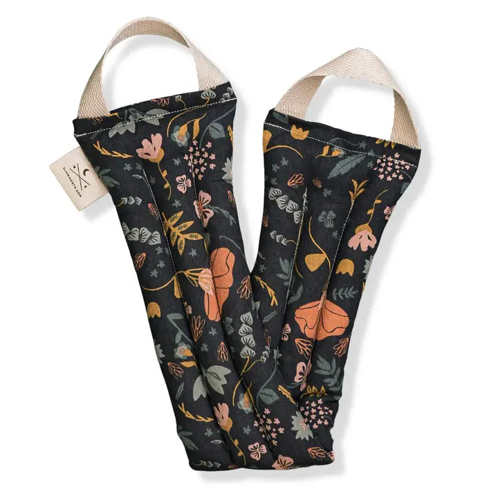 A neck wrap therapy pack with a floral pattern in multicolor, primarily in shades of orange, green, and peach, displayed on a white background.