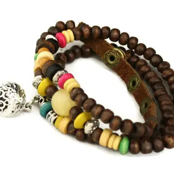 bracelet with brown beads and silver, red & yellow beaded accents, with lava bead inside of silver ball attached.