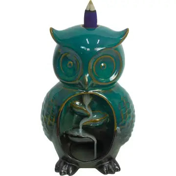 A cone incense burner shaped like an owl, with a waterfall of smoke going down the center into the bottom of the burner. On a white background.