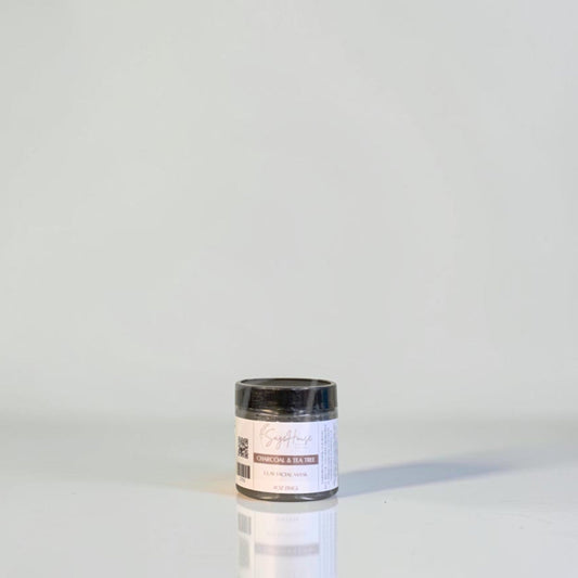 A jar with black lid and white label. On a white background.