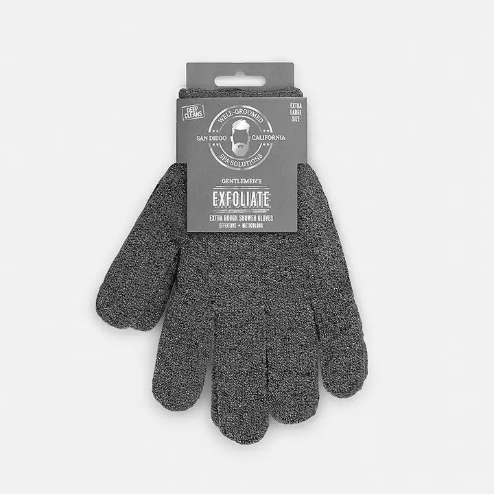 A pair of charcoal exfoliating bath gloves attached to a product label.