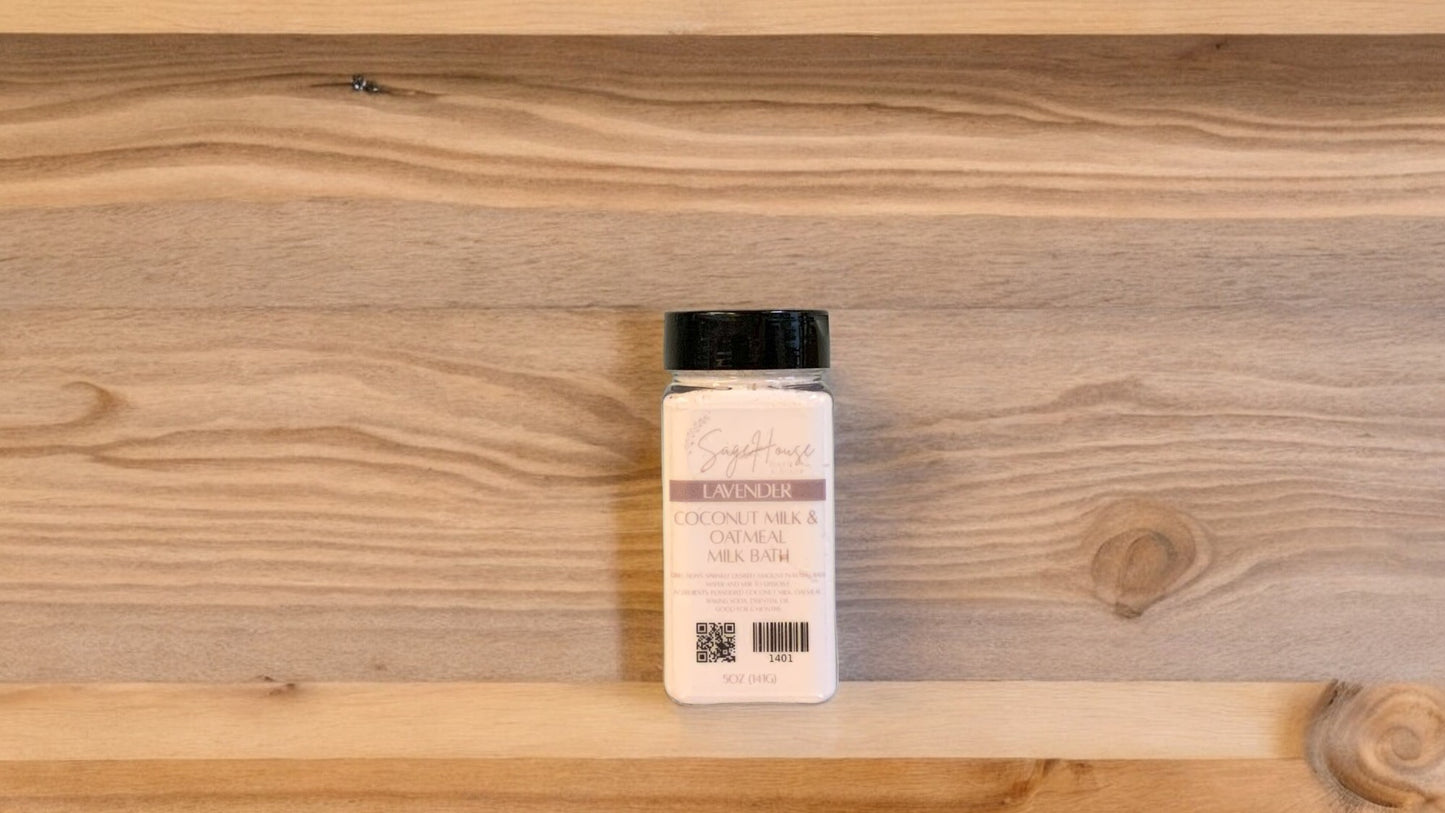 A bottle of Lavender Coconut Milk Bath powder on a wooden surface.