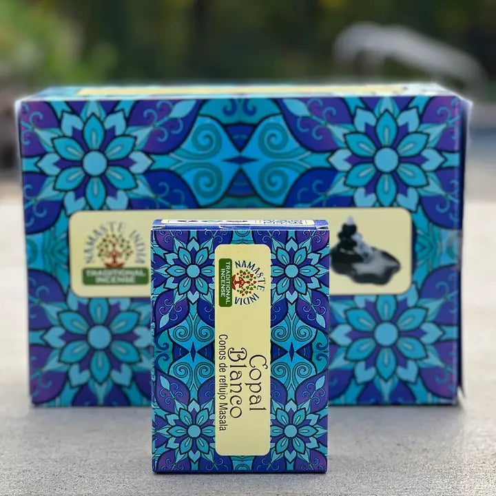 Small box of incense cones, with larger box behind with a nature background