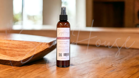 An amber colored bottle with spritz top. On wooden surface with modern background