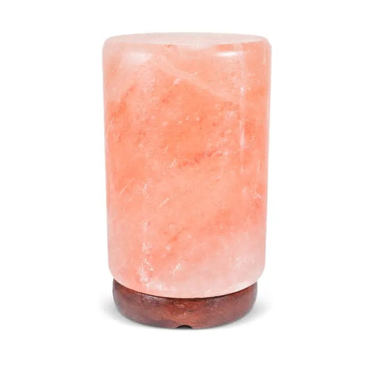 A pink Himalayan salt lamp with a cylindrical shape.