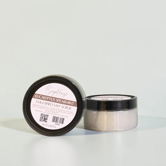 Two jars with black lids and white labels. On a white background.