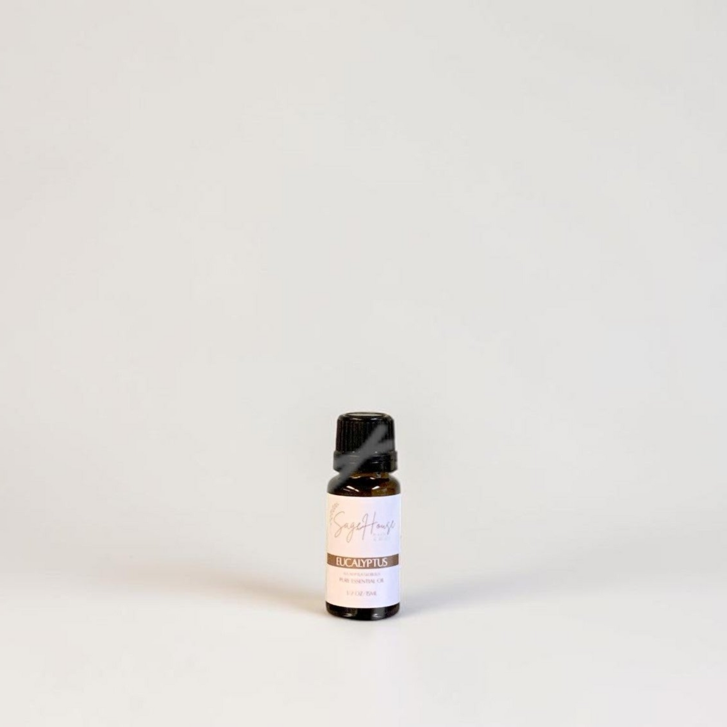 Amber bottle with label on a grey background.