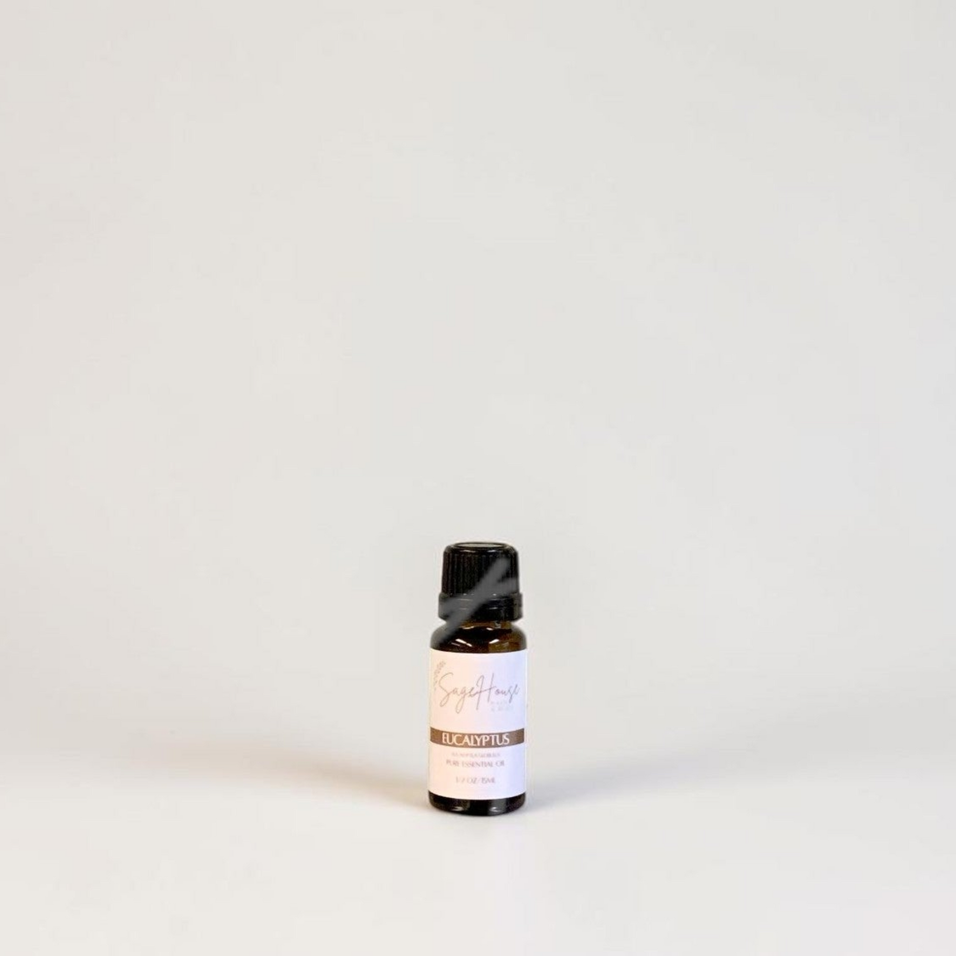Amber bottle with label on a grey background.