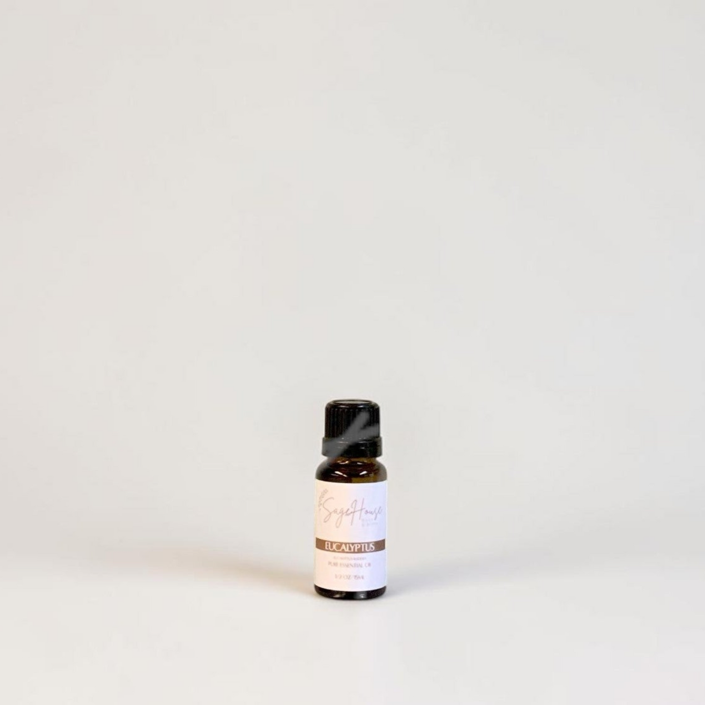 Amber bottle with label on a grey background.
