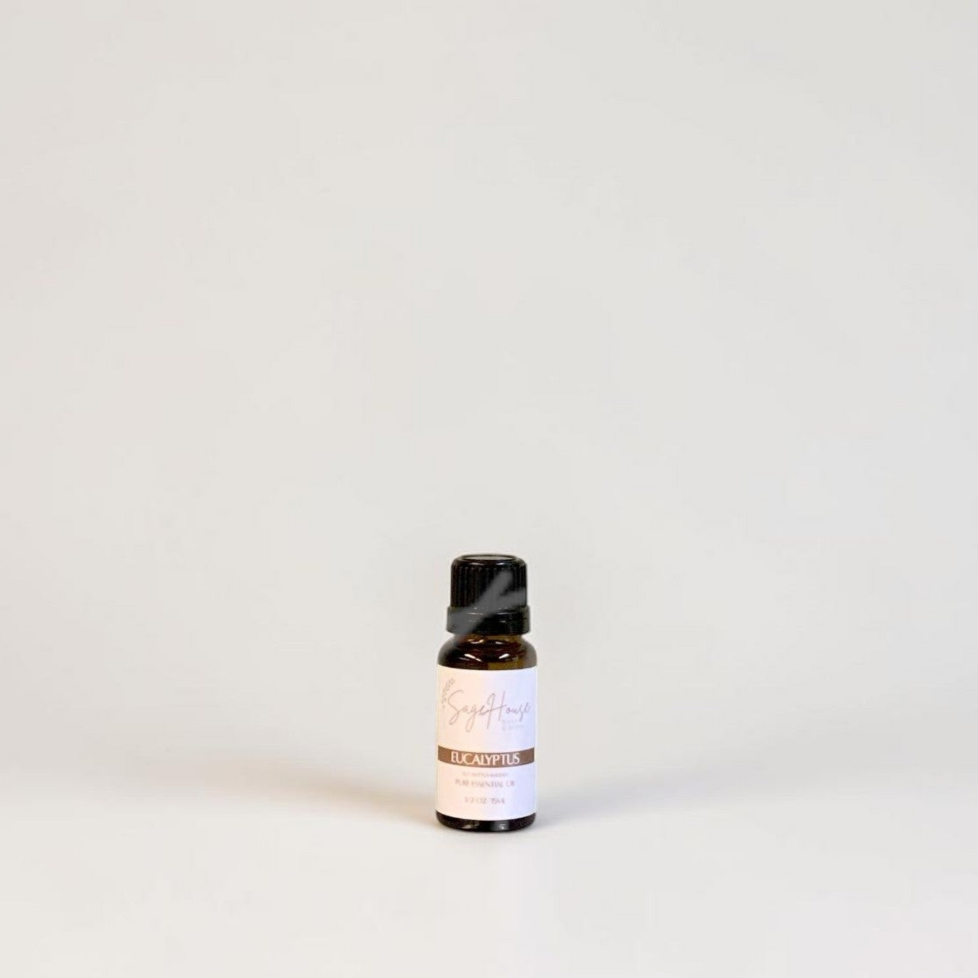 Amber bottle with label on a grey background.