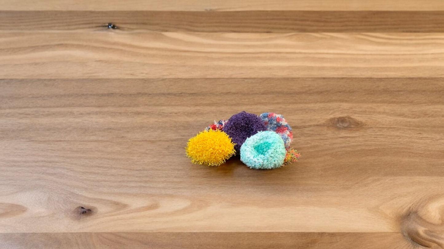 variety of colors of soft face scrubbies. sold individually