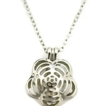 A silver flower shaped necklace with lava bead inside. on a silver chain