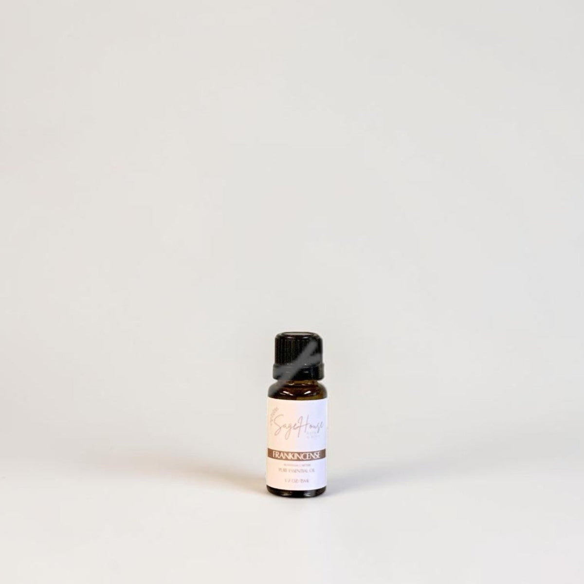 Amber bottle with label on a grey background.