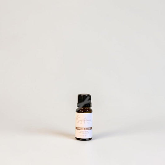Amber bottle with label on a grey background.