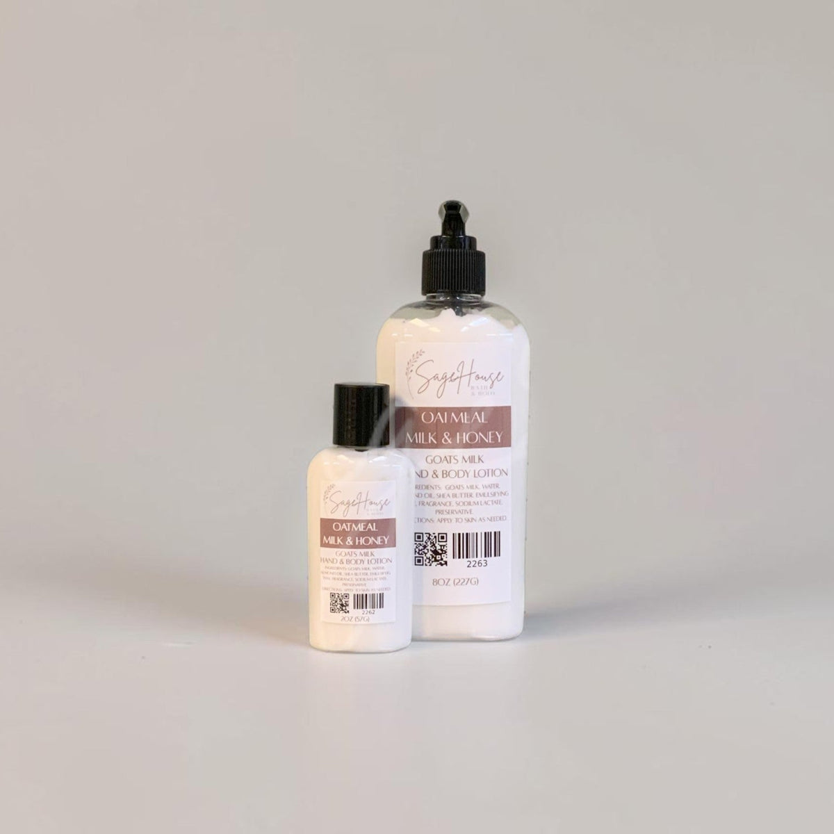 Two lotion bottles with black caps and white labels. On a white background.