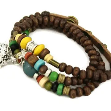 bracelet with brown beaded design, and black, green, yellow, red & blue beaded accents. lava bead inside of silver ball
