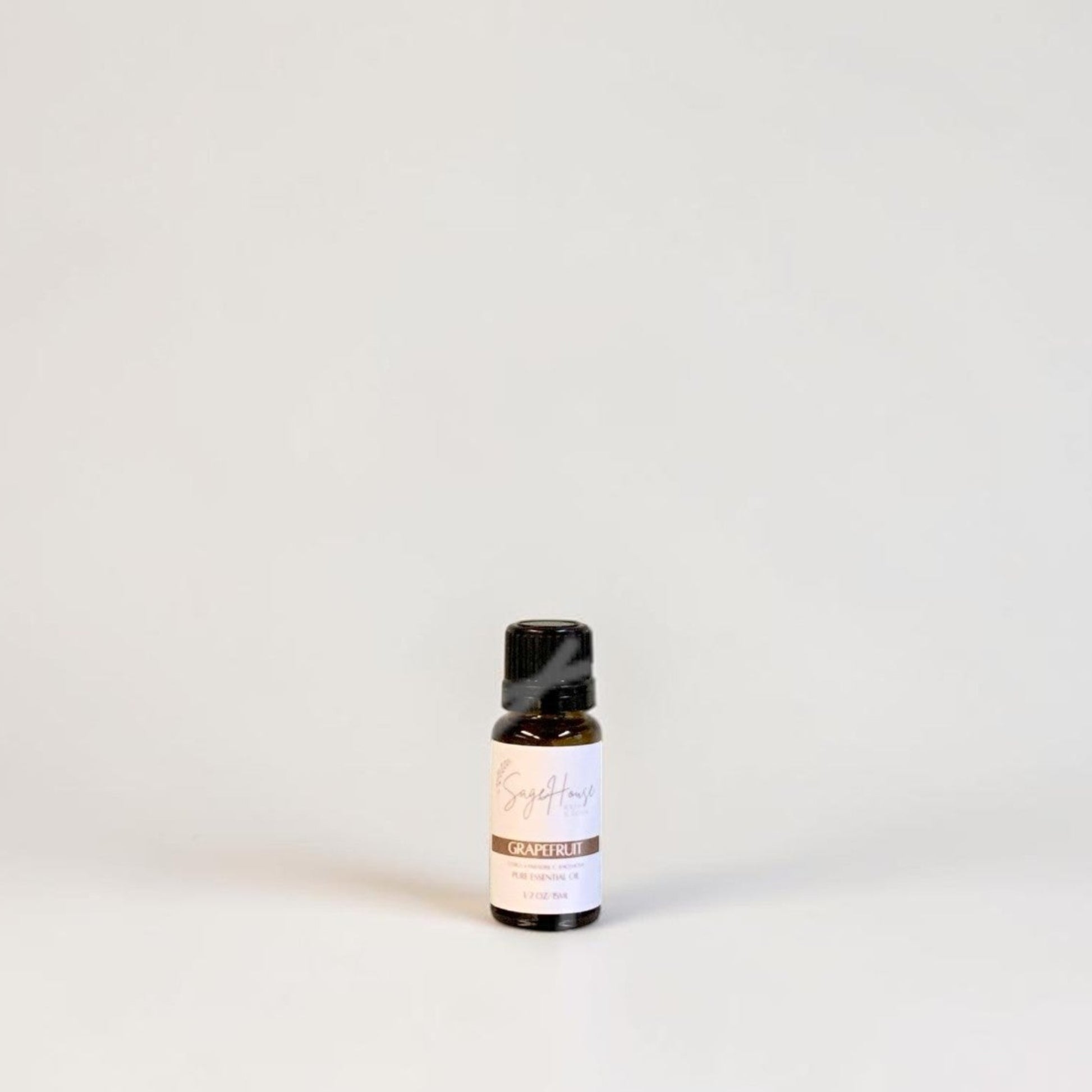 Amber bottle with label on a grey background.
