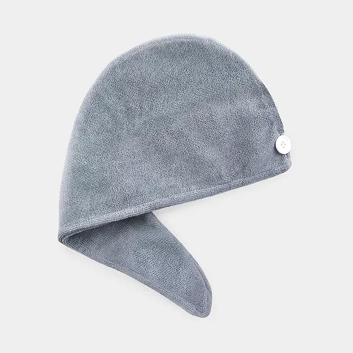 A gray microfiber hair turban with a button fastener designed to wrap around the head.