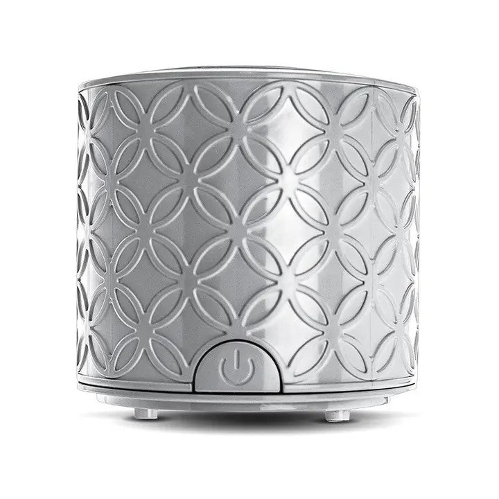 A gray, solid-patterned La Brisa diffuser designed to operate without a water reservoir, featuring a power button and used with essential oil pads.