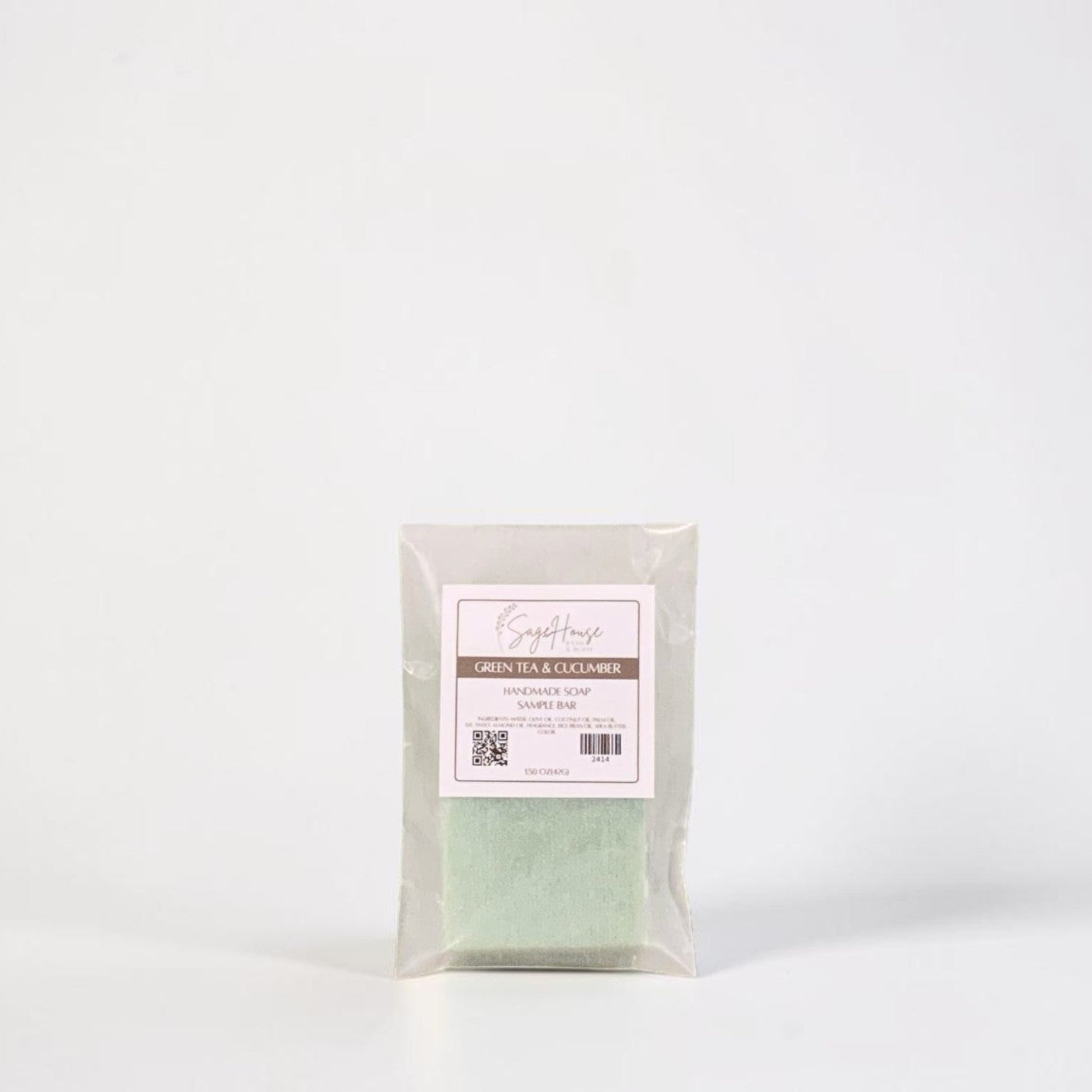 A sample bar of soap in a frosted glassine bag with label. Sitting on a white background.