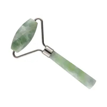 A green jade roller with silver hardware and roller on one end