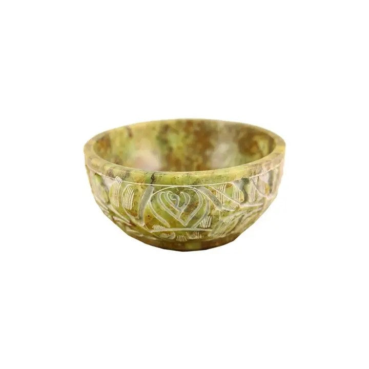 A Soapstone Bowl green color, with zen design on a white background
