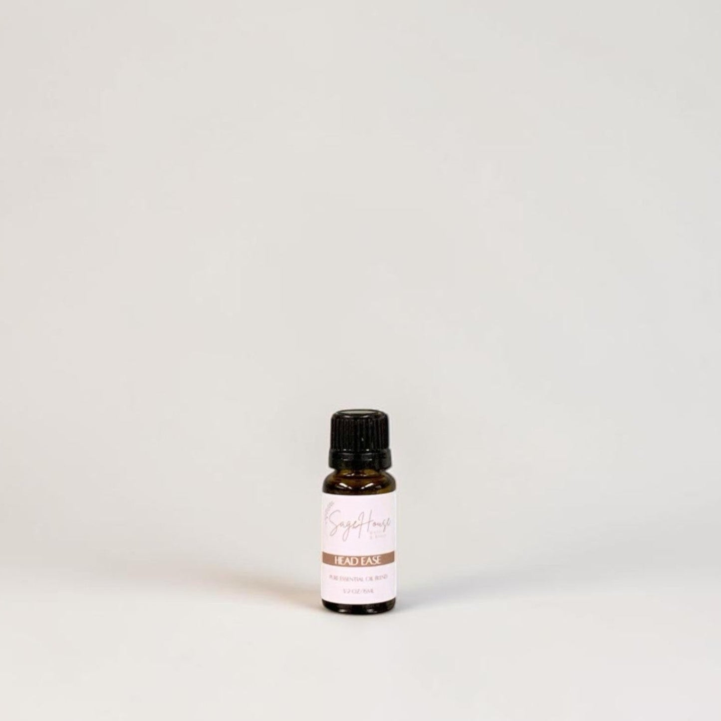 Amber bottle with label on a grey background.