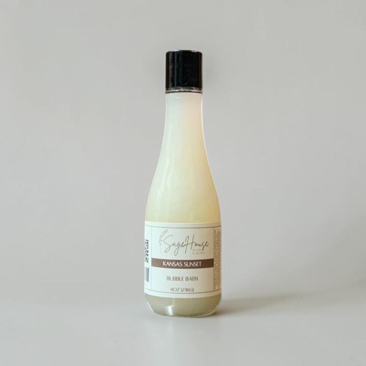 Bottle of bubble bath on a light gray background