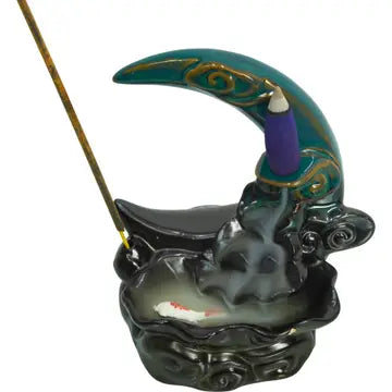 A cone incense burner shaped like the moon, with a waterfall of smoke going down into the attached bowl. On a white background.