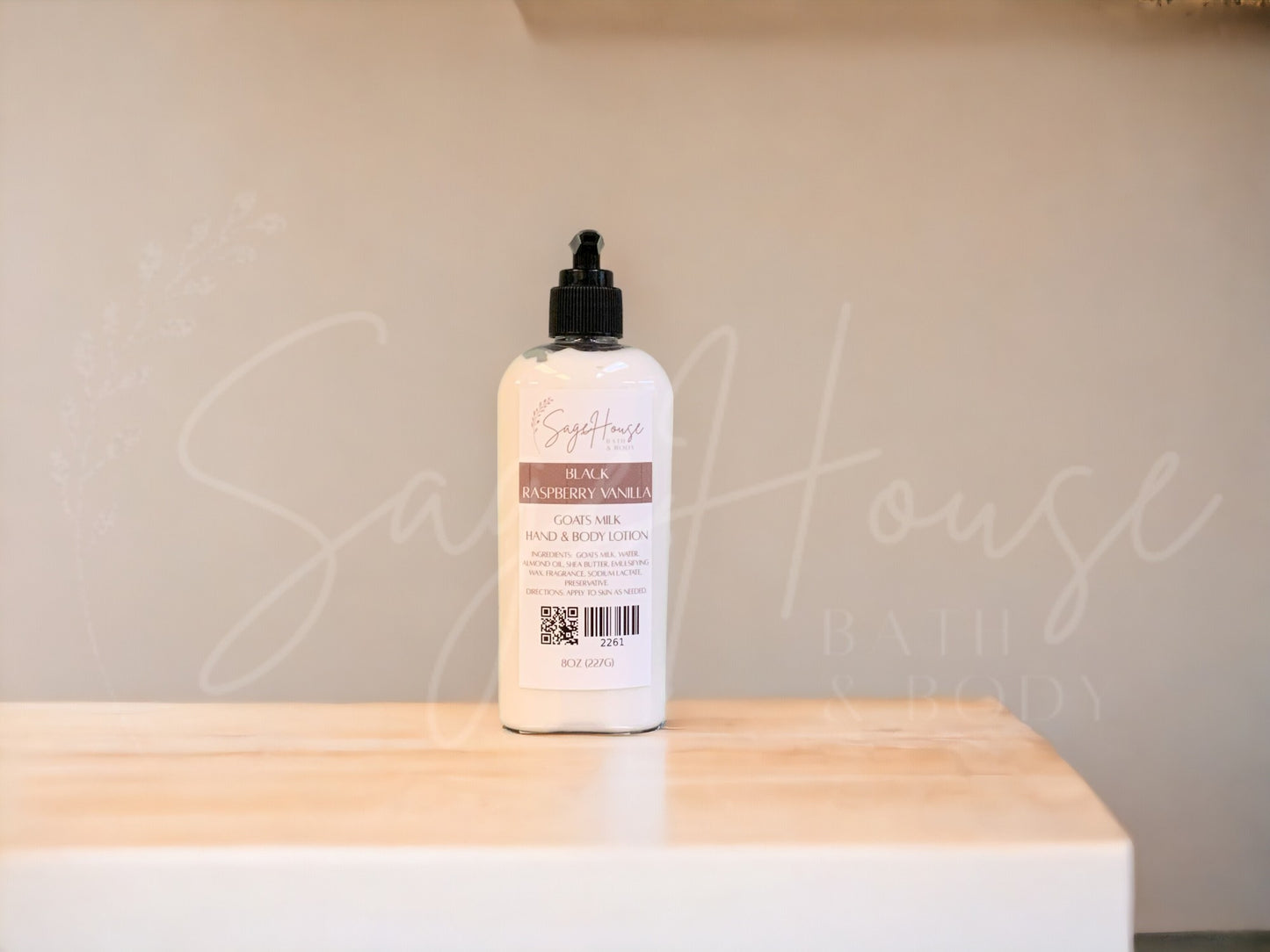 A Large bottle of lotion with black pump top, on a wooden surface with a neutral background