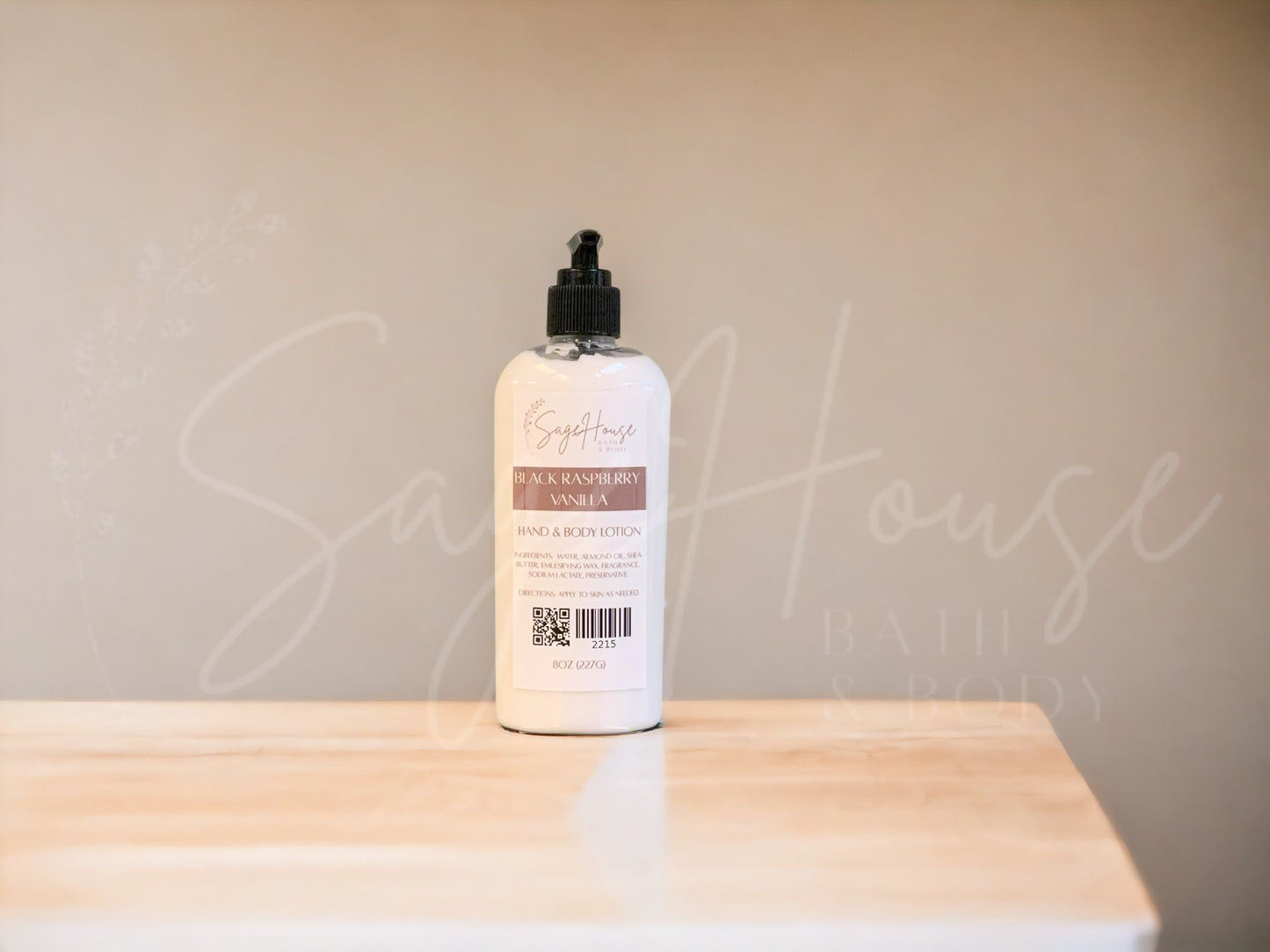 A Large bottle of lotion with black pump top, on a wooden surface with a neutral background