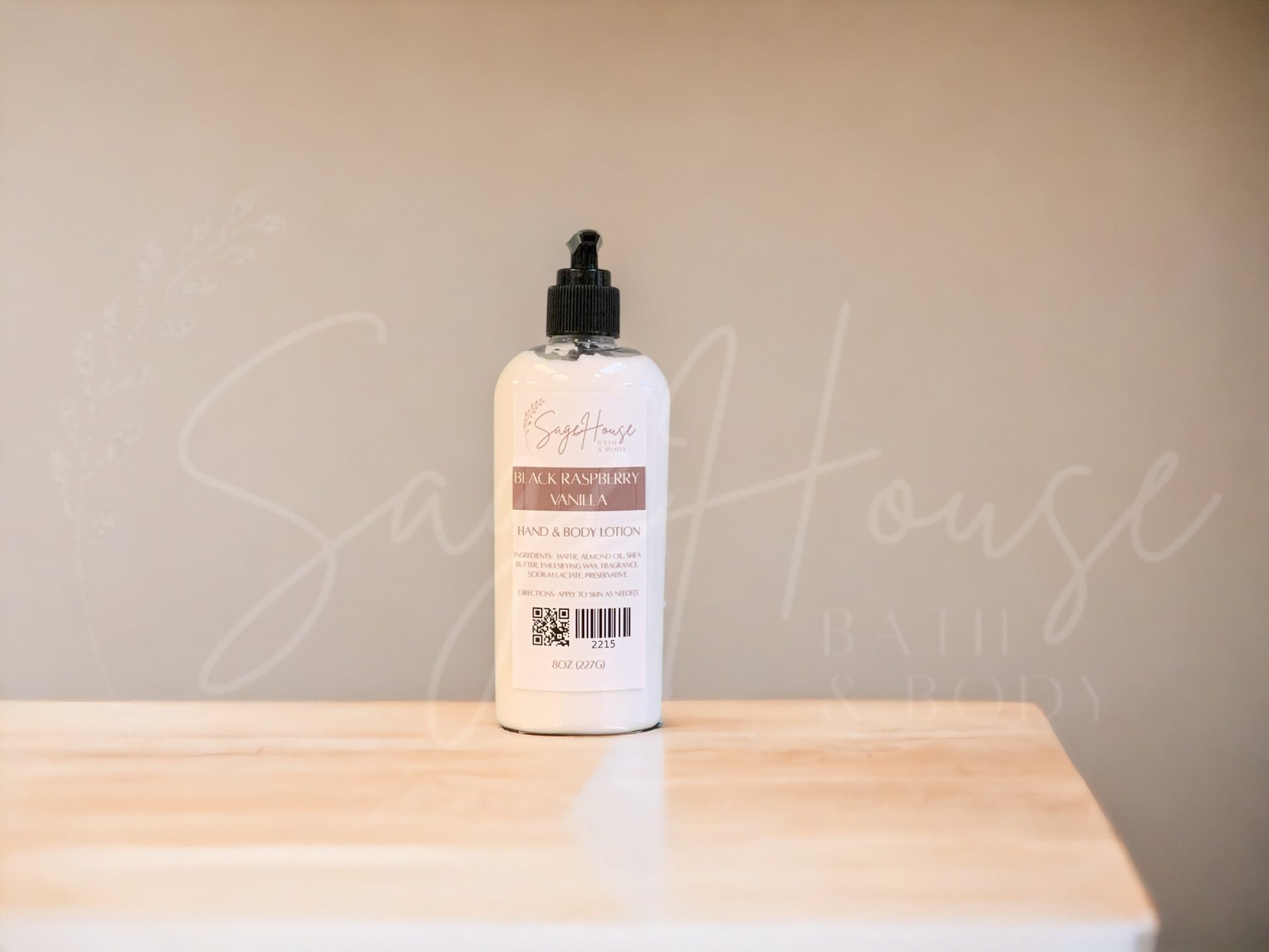 A Large bottle of lotion with black pump top, on a wooden surface with a neutral background