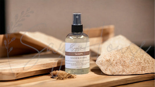 Amber colored spritz bottle with sleepy label, on wood surface