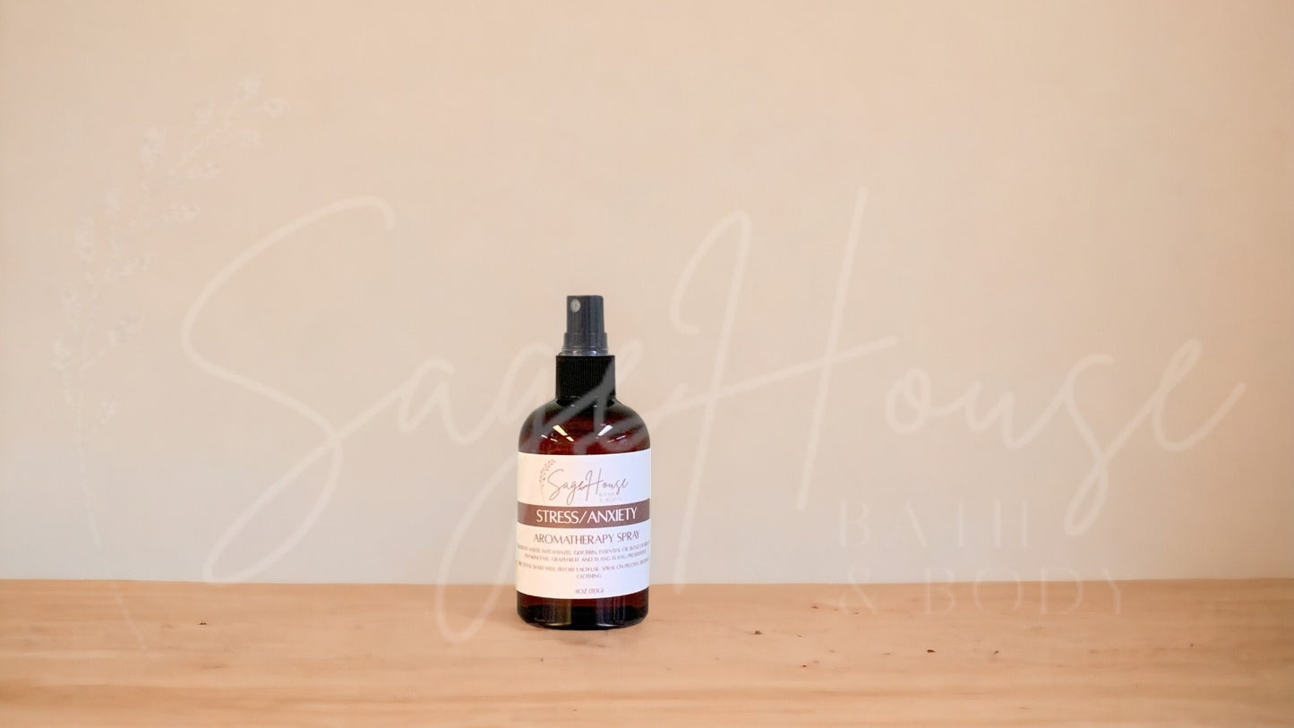 Amber colored spritz bottle with anxiety and stress label, on wood surface