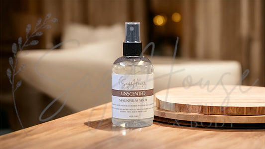 Amber colored spritz bottle with unscented label, on wood surface