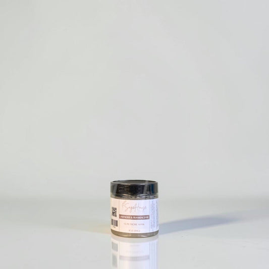 A jar with black lid and white label. On a white background.