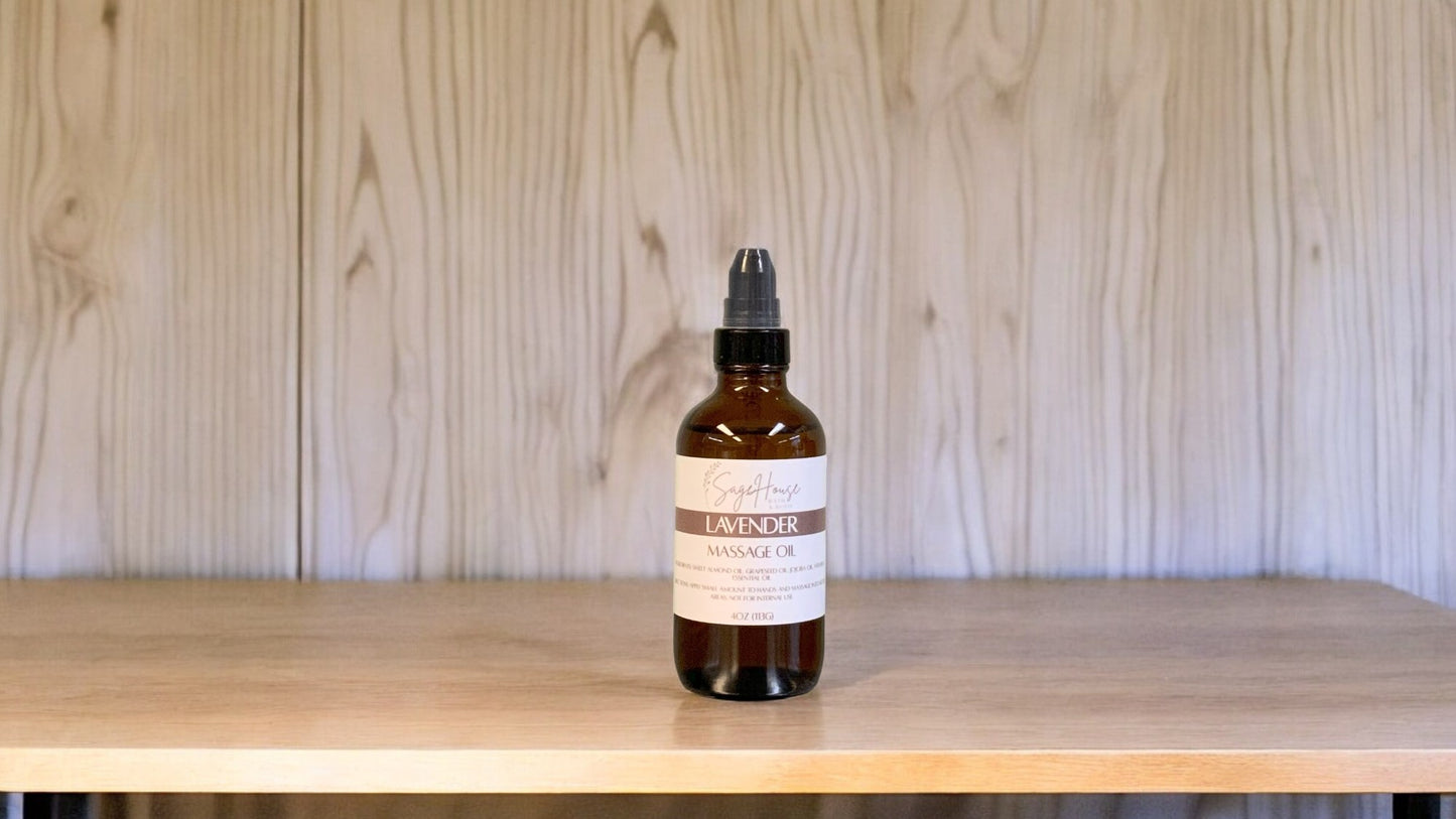 A Bottle with a treatment pump, labeled with 'lavender Massage Oil', positioned on a wooden surface.