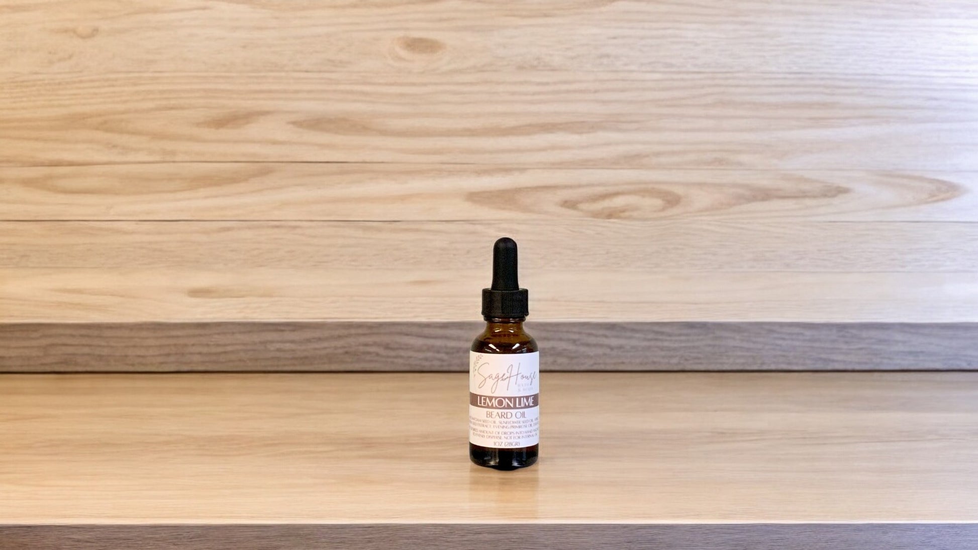 A dropper bottle labeled "lemon lime" on a wood top and background