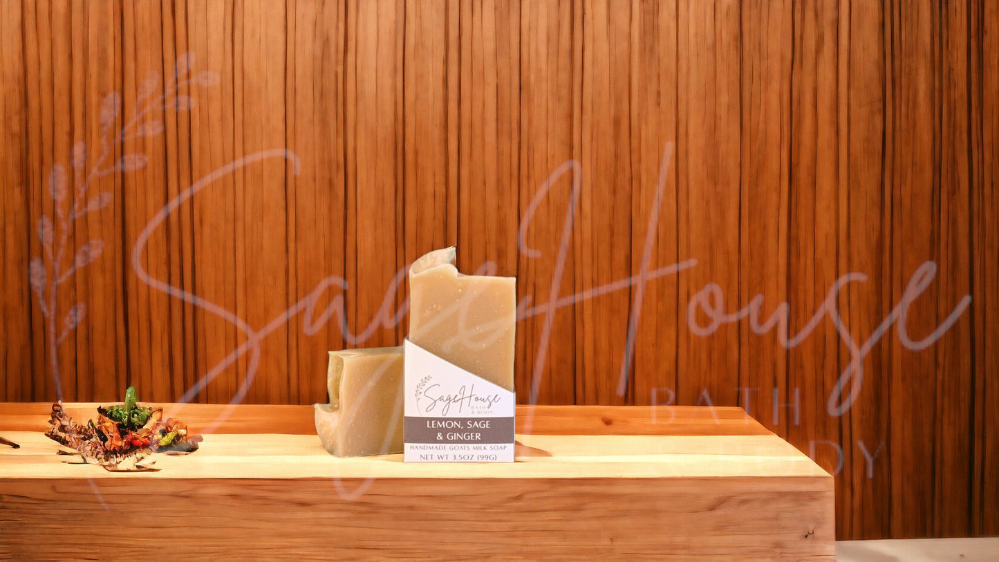 A tan bar of soap in a white labeled box, on a wood surface.