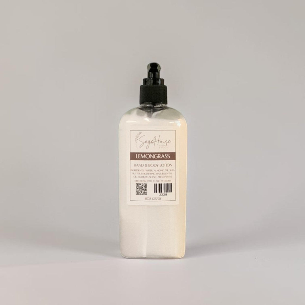 A large bottle of lotion with black pump top and white label. On a white background.